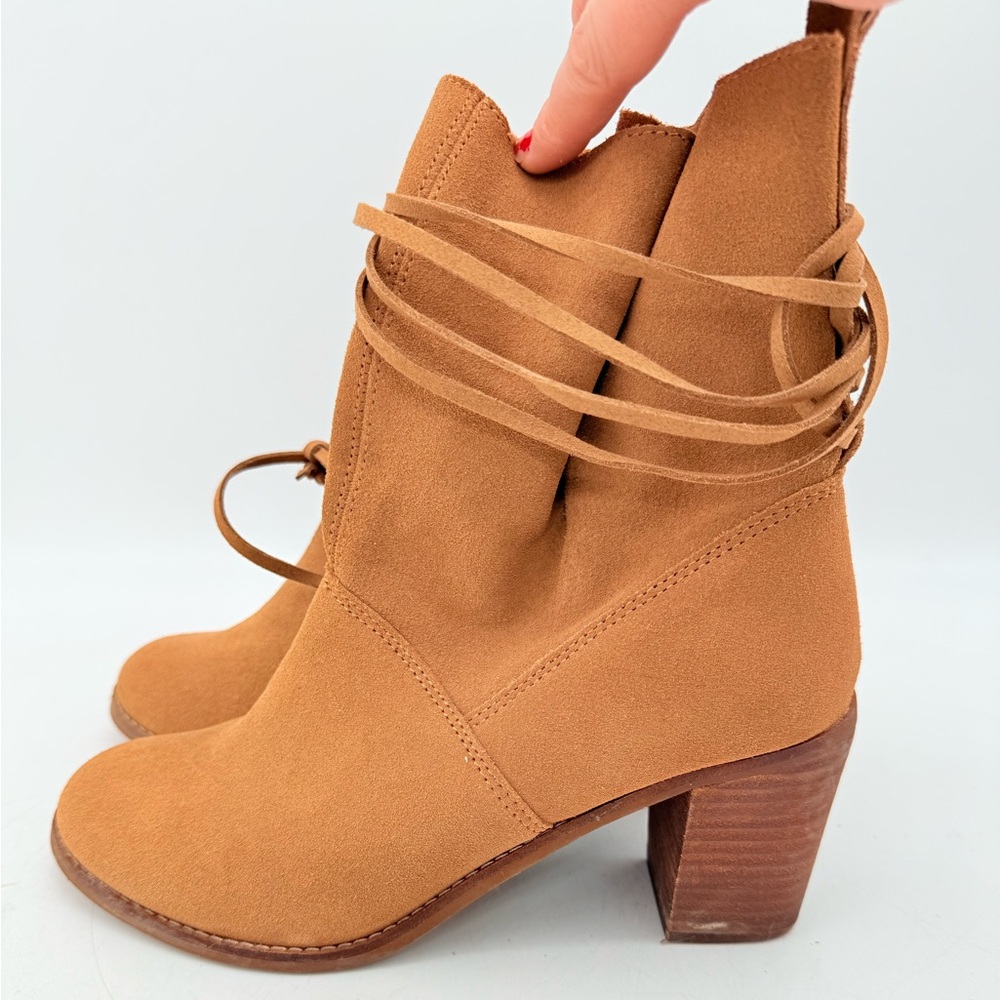 pair of TOMS Mila Suede Booties in the Toffee Suede colorway